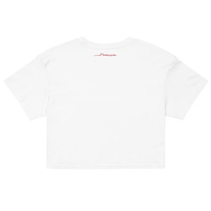 May include: White cropped t-shirt with a small red sun graphic and the text "Sunrise on Sale" on the back.