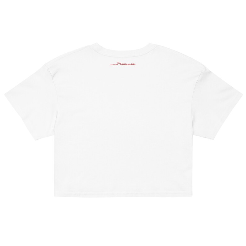 May include: White cropped t-shirt with a small red sun graphic and the text "Sunrise on Sale" on the back.