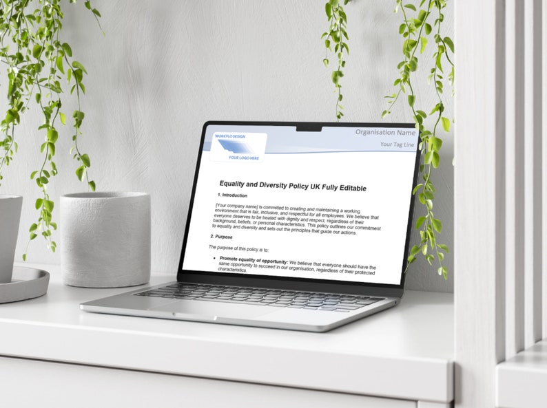 May include: A laptop computer displaying a document titled "Equality and Diversity Policy UK Fully Editable". The document outlines the company's commitment to creating a respectful and inclusive work environment for all employees.
