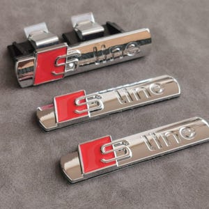 Emblema Sline de Parilla Calandra mas 2 Logos Laterales Color Gris Accesorios para Coches Tuning