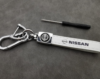 Witte leren Nissan-sleutelhanger, autoaccessoire