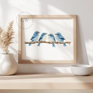 May include: A watercolour painting of four bluebirds perched on a branch. The birds are facing different directions and have light blue bodies with white bellies. The background is white.