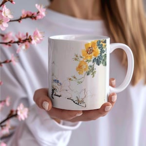 フローラルアートマグ、桜コーヒーマグ、芸術的な花のデザインマグ、植物イラストマグ、自然にインスパイアされたドリンクウェア
