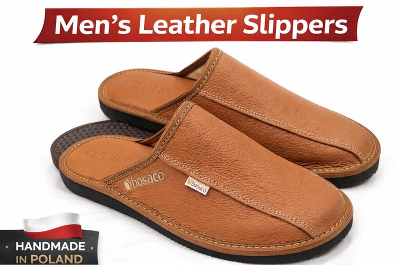 May include: A pair of brown leather slippers with a stitched design and a black sole. The slippers have a textured appearance and the text "Men's Leather Slippers" is displayed on a red banner. The slippers are handmade in Poland.
