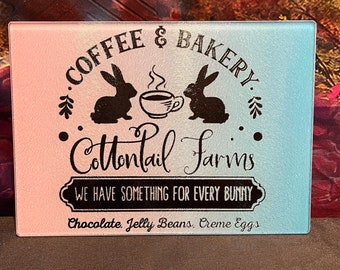 Cottontail Farms Coffee & Bakery, Easter Bunny themed Small Glass Cutting Board, black with pastel pink and blue background