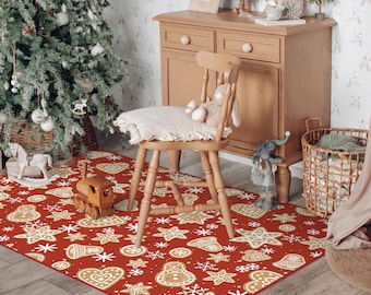 May include: A red rectangular rug with a repeating pattern of gingerbread cookies and snowflakes. The cookies are in various shapes, including stars, hearts, and gingerbread men. A wooden train toy sits on the rug near a Christmas tree.