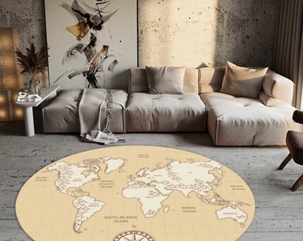 May include: A round beige rug with a vintage world map design. The rug features a compass with the letters N, S, E, and W. The map includes the names of the oceans: Pacific Ocean, North Atlantic Ocean, South Atlantic Ocean, Indian Ocean, and Arctic Ocean.