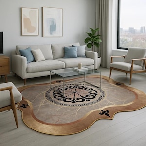 May include: A decorative area rug with a unique shape and design. The rug features a central circular pattern in black and pink, surrounded by a marble-like texture and a gold border. The rug is placed in a living room setting.