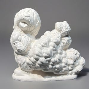 May include: White ceramic figurine of a dog wearing a hat and carrying a large bundle of pine branches.