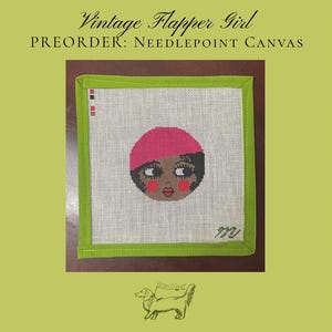 May include: A square needlepoint canvas featuring a stylized face with a pink cloche hat, dark hair, and red cheeks. The canvas has a lime green fabric border and includes the text Vintage Flapper Girl PREORDER: NEEDLEPOINT CANVAS.
