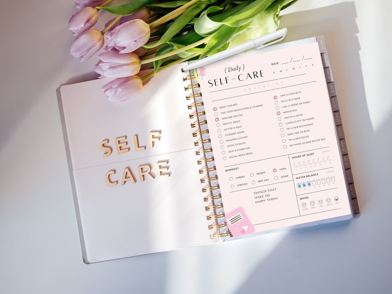 May include: A pink and white self-care checklist planner with a gold spiral binding. The checklist includes items like "Take a long bath", "Go for a walk", "Meditate", and "Read a new book".