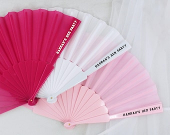 May include: Three hand fans in pink, white, and red with black text that reads "Hannah's Hen Party".