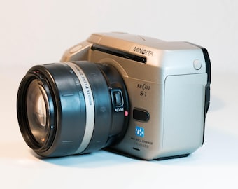 Fotocamera a pellicola Minolta Vectis S-1 APS con obiettivo 22-80 mm - Testata e funzionante.