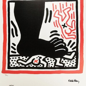 May include: A black and white print of a large foot stepping on a smaller figure. The smaller figure is red and has a red X on its chest. The background is black and white with a red border.