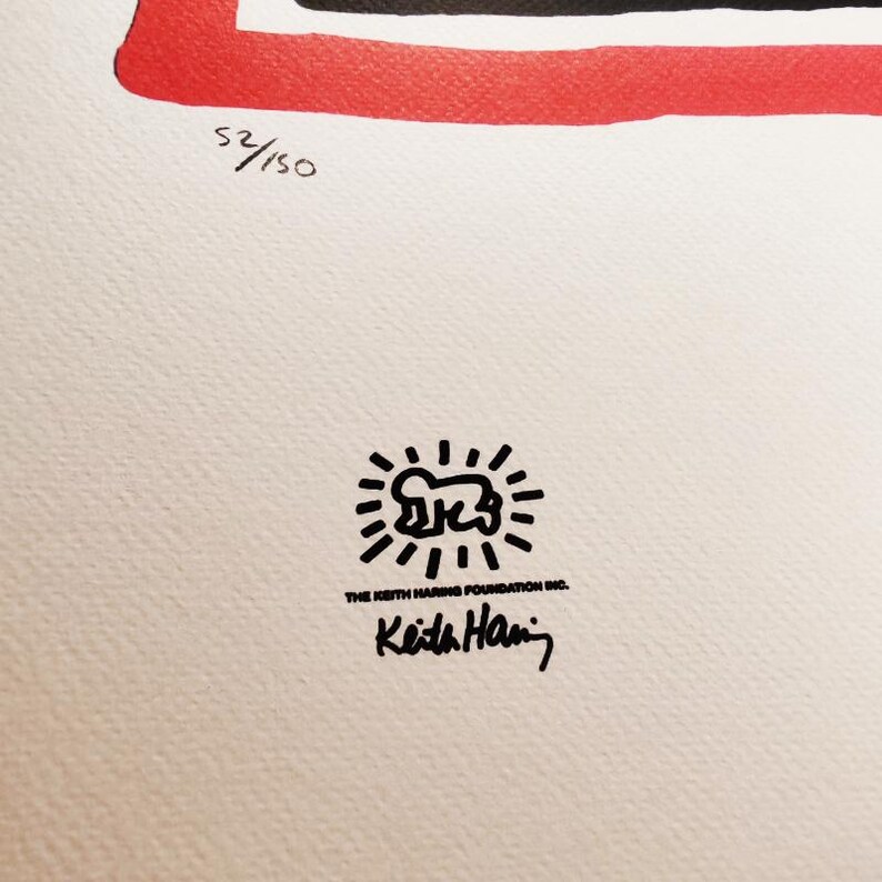 May include: Black and white illustration of a stick figure with a sunburst around it. The text "THE KEITH HARING FOUNDATION INC." and "Keith Haring" are below the illustration.