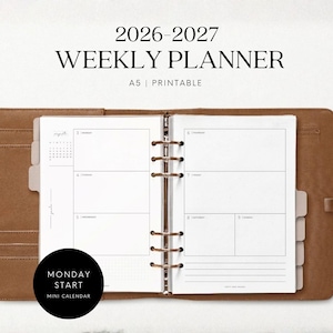 May include: A 2026-2027 weekly planner in an A5 printable format, featuring a brown leather-style binder with a six-ring metal mechanism. The open pages display a weekly layout with a Monday start, a mini calendar, and lined sections.
