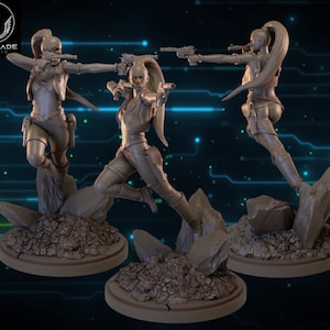 May include: Three grey painted figurines of a female character in a sci-fi setting. The character is wearing a brown vest, black trousers, and boots. She is holding a blaster in each hand. The figurines are posed in different action poses.