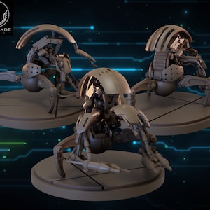 May include: Three gray, articulated, mechanical spider-like robots with segmented legs and a dome-shaped head. The robots are posed on circular bases.
