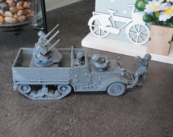May include: A gray plastic model of a military vehicle with a rotating turret and three guns. The vehicle has a flatbed and is carrying three figures. The figures are also gray plastic and are wearing military uniforms.