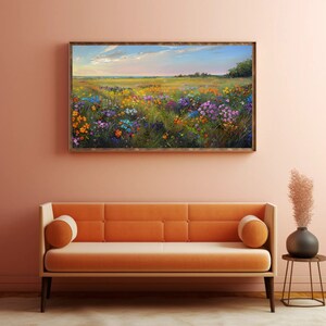 May include: A painting of a field of wildflowers in various shades of pink, purple, yellow, and blue. The field is set against a backdrop of a blue sky with white clouds.