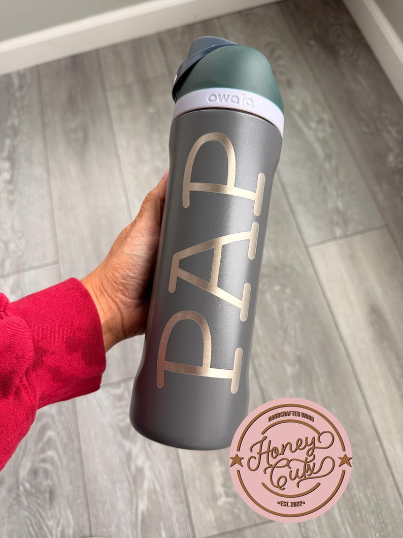 May include: A set of three ceramic mugs with a speckled, matte finish. The mugs are in shades of cream, light gray, and dark gray. Each mug has a simple, minimalist design, perfect for coffee or tea.