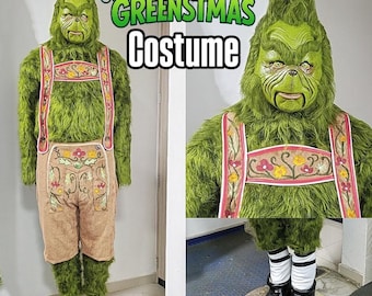 May include: A full-body green costume with a Grinch-like face, featuring a furry texture. The costume includes a mask, suspenders, and brown shorts with floral embroidery. The text "GREENSTMAS Costume" is displayed.
