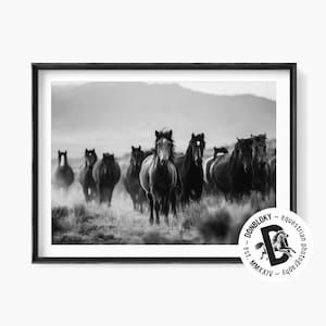 Striking black and white photo of wild horses running free. Printable artwork ideal for rustic, western, or equestrian-themed interiors.