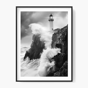 May include: Monochrome framed print of a lighthouse on a cliff face, with powerful waves breaking. The lighthouse is white with a black lantern room, set against a stormy sky.