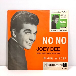 May include: A vintage orange and white record label with a black and white photo of a man. The record is titled "No No" by Joey Dee with Fats and His Cats. The record label is for the song "Immer Wieder" and is on the Roulette label. The record number is RL 4413.