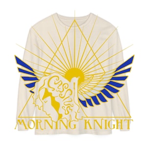 May include: A long-sleeved, cream-colored t-shirt with a graphic design featuring a stylized sun with rays, a winged figure, and the text "Morning Knight".