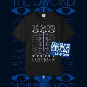 May include: Black t-shirt with the text "THE SWORD, OUR ORATOR!" and a blue and white graphic design. The design includes eyes, hands, and a sword-like shape. A sticker on the right says "BEER IS THE MIND-KILLER on Etsy.com".