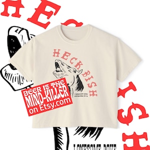 May include: A white ceramic mug with a black handle and the text "But First, Coffee" in a handwritten style. The mug is likely 11 ounces and sits on a white surface.