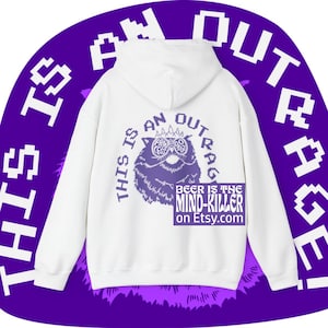 May include: White hoodie with a purple graphic of an owl wearing glasses and the text "THIS IS AN OUTRAGE". Below the owl is the text "BEER IS THE MIND-KILLER on Etsy.com". The hoodie has a hood and long sleeves.