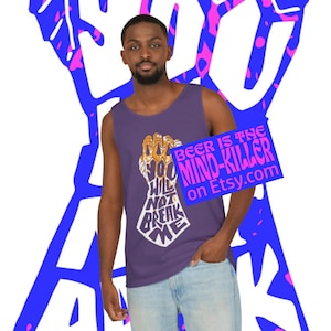 May include: A purple tank top with a graphic of a golden hand clenching a fist, with the words "YOU WILL NOT BREAK ME" in white. A blue sign reads "BEER IS THE MIND-KILLER on Etsy.com".