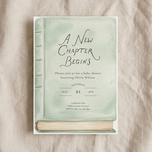 May include: A baby shower invitation card designed to resemble a book. The cover is a pale green with the words "A New Chapter Begins" in elegant script. Details include the date, time, and location for Olivia Wilson's baby shower.