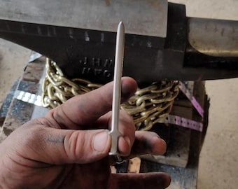 Miniature sword made from duplex nail.