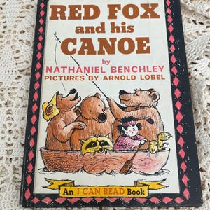 May include: A vintage children's book cover featuring a red fox and his friends in a canoe. The title is "Red Fox and his Canoe" by Nathaniel Benchley with illustrations by Arnold Lobel. The book is part of the "I Can Read Book" series.