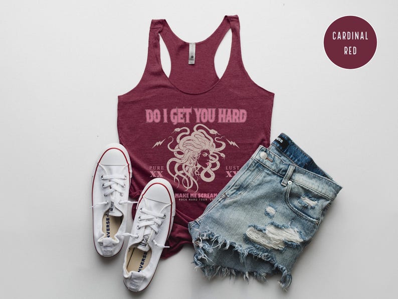 May include: A burgundy tank top with the text "DO I GET YOU HARD" and a Medusa graphic, alongside distressed denim shorts and white trainers. A "CARDINAL RED" colour swatch is also visible in the image.