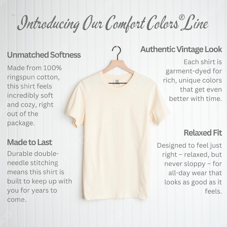 May include: Cream-colored t-shirt hanging on a wooden hanger. The shirt is part of the "Comfort Colors" line and is made of ringspun cotton. Text on the left describes the shirt's softness and durability. Text on the right describes the vintage look and relaxed fit.
