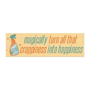 May include: A rectangular sticker with a light yellow background. The sticker features an illustration of an orange spray bottle with a teal cap and the text "OPALITE" on the label. The text "magically turn all that crappiness into happiness" is written in teal and orange.
