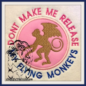 May include: A pink and blue embroidered patch with a winged monkey and the text "Don't Make Me Release The Flying Monkeys".