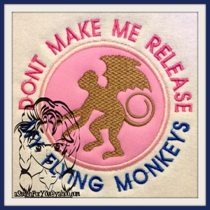 May include: A pink and blue embroidered patch with a winged monkey and the text "Don't Make Me Release The Flying Monkeys".