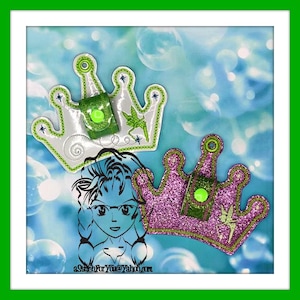 May include: Two sparkly crown-shaped eyeglass holders, one white with green accents and one pink with green accents. Both have a green fairy design and a green button.