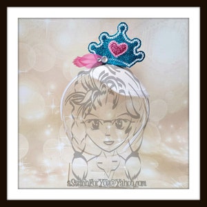 May include: A blue and pink princess crown headband with a heart-shaped jewel. The headband is on a white background with a sparkly effect.