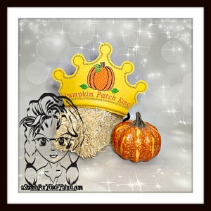 May include: A yellow crown with a pumpkin and the text "Pumpkin Patch King" on it. The crown is sitting on a bale of hay with a small orange pumpkin in front of it.