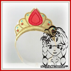 May include: Gold headband with a red and blue jeweled crown. The crown has a large red gem in the center and smaller blue gems on the sides. The headband is decorated with gold glitter and small gold flowers.