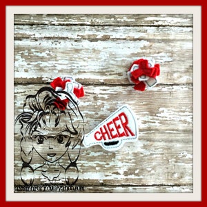 May include: A set of three red and white felt appliques. The appliques are a cheerleader with a megaphone, a pom-pom, and a megaphone with the word "CHEER" on it.