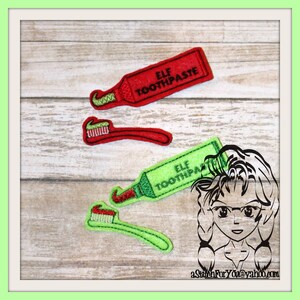 May include: Two sets of embroidered iron-on patches for a Christmas elf's toothbrush and toothpaste. The patches are green and red with the words "Elf Toothpaste" on the toothpaste tubes.