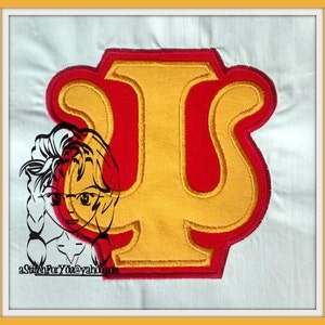 May include: Embroidered patch featuring a gold letter "Ψ" within a red border. The patch has a textured appearance and is set against a white background. A cartoon illustration of a woman is partially visible on the left side. The text "aStitchForYou@yahoo.com" is also visible.