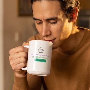 May include: White ceramic coffee mug with a humorous coding design. The design features a pixelated coffee cup with steam rising from it and the text "let coffee=new Coffee(); if coffee.isEmpty) coffee.refill();".